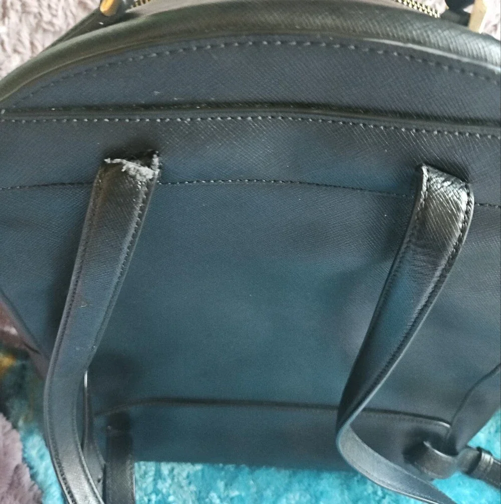 AS-IS Kate Spade black leather backpack LEFT STRAP AT THE TOP TORN. STILL NEW